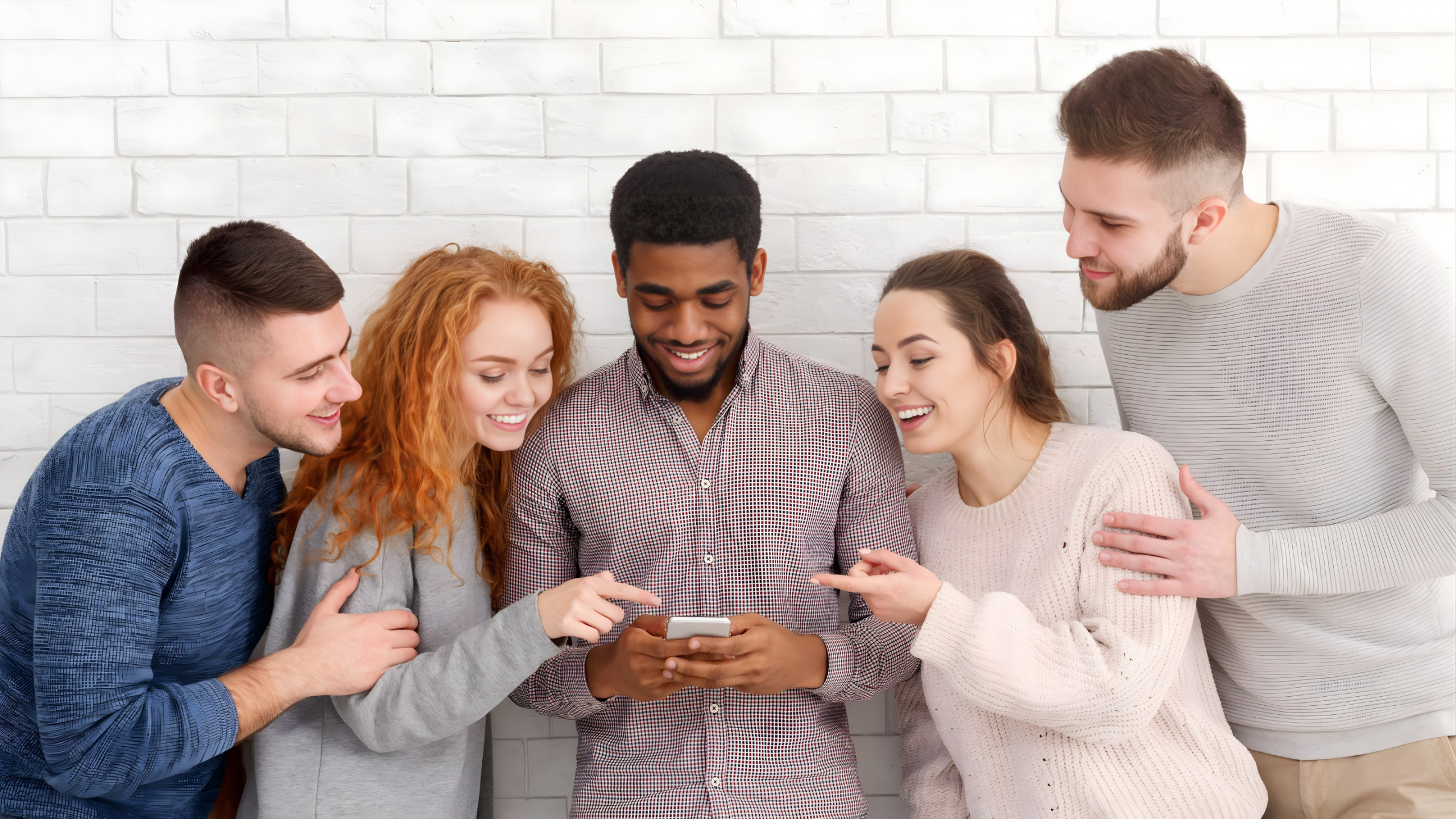 Group of people using mobile technology representing teamwork, collaboration, digital learning, and business growth with GOLIVEA Elevate.