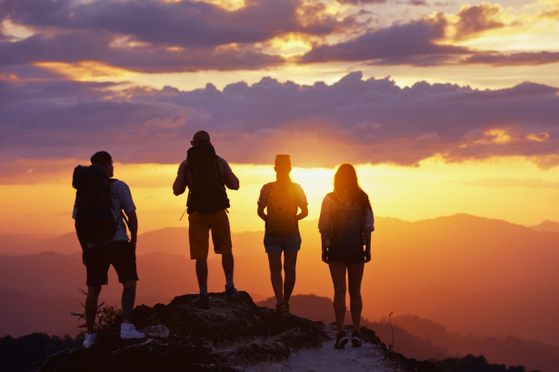 Group lifestyle visual at sunset representing shared purpose, freedom, and collective wellbeing through GOLIVEA.